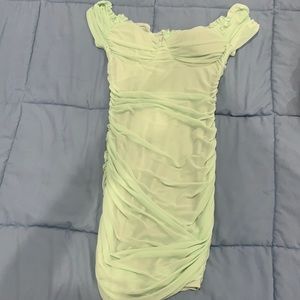 This mint dress has only been worn once. Can be worn off the shoulder.